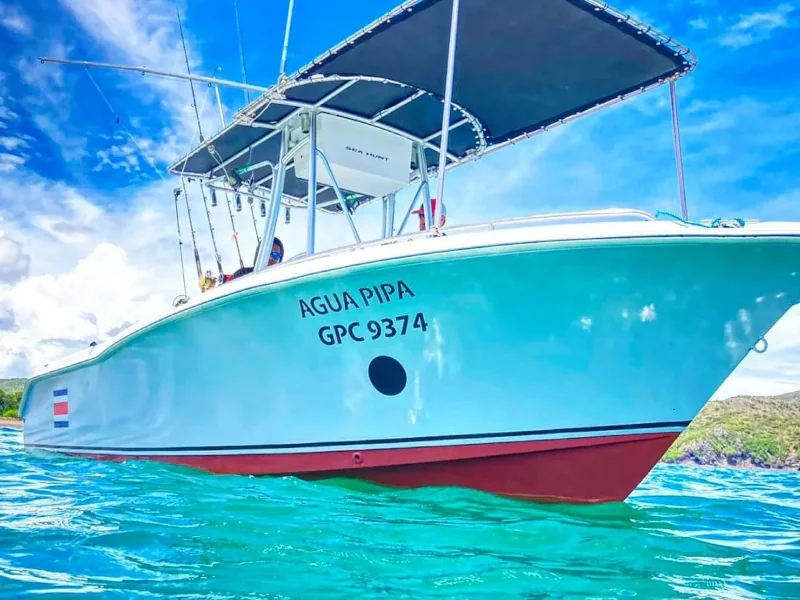 Agua Pipa charter boat by Sea Hunt Fishing on the turquoise waters of Playa Potrero, Costa Rica