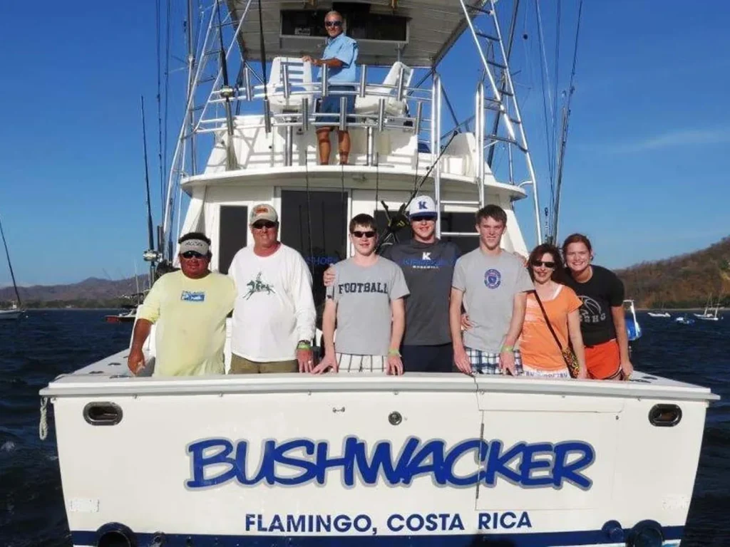 The Bushwacker, a 42-foot Bertram sport fishing charter, underway off Playa Flamingo with the Catalina rock behind
