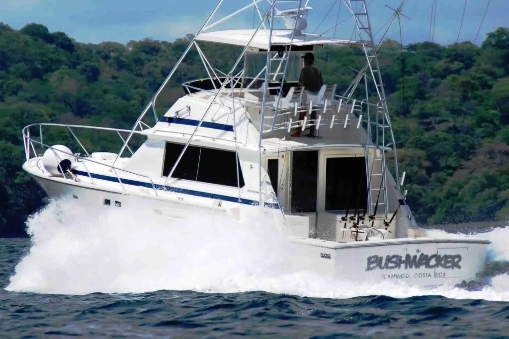 The Bushwacker sportfishing boat underway off Playa Flamingo, Costa Rica, tower and outriggers rigged