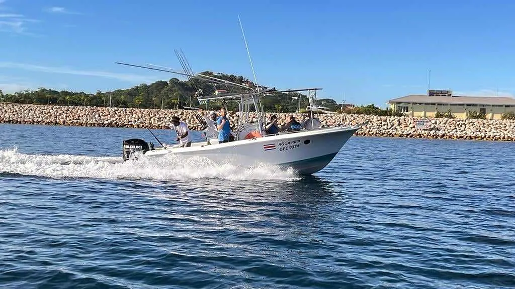 The Sea Hunt fishing charter heading out from the marina at Playa Potrero, Guanacaste, Costa Rica